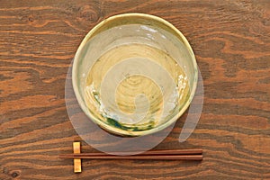 Empty Japanese dish with chopsticks