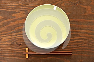 Empty Japanese dish with chopsticks