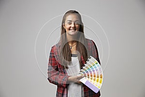 Studio Shot Of Female Graphic Designer With Color Swatches
