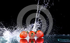 Studio shot with freeze motion of cherry tomatoes