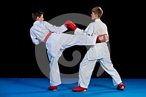 The studio shot of group of kids training karate martial arts