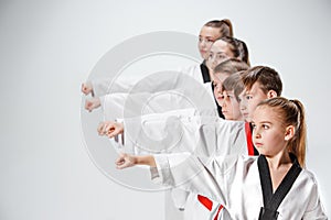 The studio shot of group of kids training karate martial arts