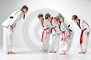 The studio shot of group of kids training karate martial arts