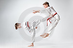 The studio shot of group of kids training karate martial arts