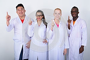 Studio shot of happy diverse group of multi ethnic doctors smili