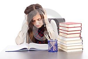 Studio shot of hopeless student with hands on head sitting at hi