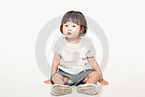 A studio shot of a Korean girl young child