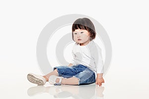 A studio shot of a Korean girl young child