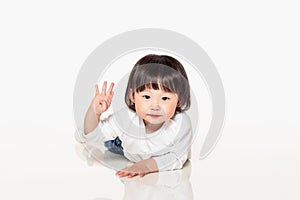 A studio shot of a Korean girl young child