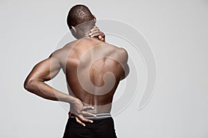 Studio shot of man with pain in neck