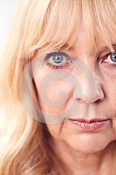 Studio Shot Of Mature Woman Looking Suspicious And Distrustful