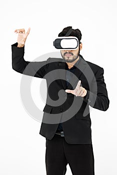 Studio shot of Millennial Asian smart professional successful businessman ceo entrepreneur wearing virtual reality VR goggles