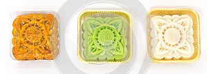 Studio shot moon cake and snowskin custard in transparent airtight packaging isolated on white