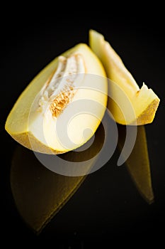 Studio shot of notched ripe melon galia with slice