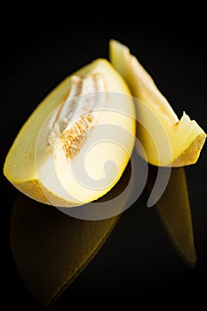 Studio shot of notched ripe melon galia with slice