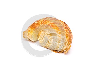 Studio shot one half cut of fresh baked French butter croissant isolated on white