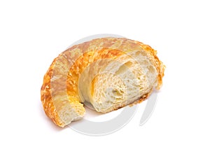 Studio shot one half cut of fresh baked French butter croissant isolated on white