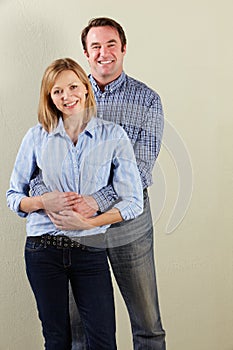 Studio Shot Of Relaxed Middle Aged Couple