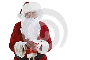 Studio Shot Of Santa Claus Holding Gift Wrapped Present