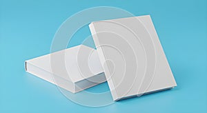 Two white rectangular boxes on a light blue background in studio shot