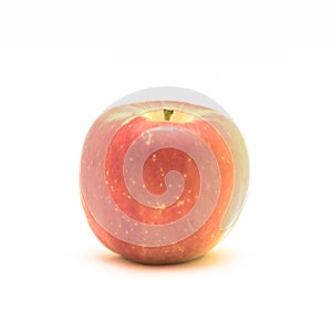 Studio shot single raw Fuji apple isolated on white