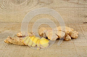 Studio shot of sliced ginger isolated on wooden table