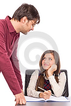 Studio shot of teacher helping student with her homework