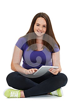 Studio Shot Of Teenage Girl Using Digital Tablet