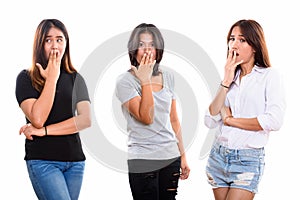 Studio shot of three young Asian woman friends looking shocked