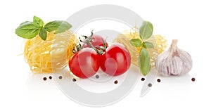 Studio shot of tomatoes,pasta and basil on white
