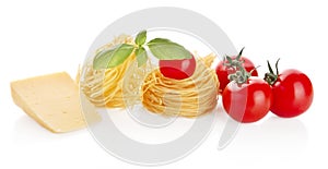 Studio shot of tomatoes,tagliatelle,basil and cheese on white