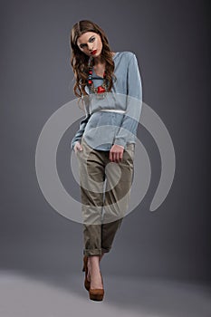 Studio Shot of Trendy Fashion Model in Pants and Blouse