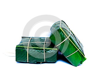 Studio shot two Chung Cakes square sticky rice cake Vietnamese New Year food isolated on white