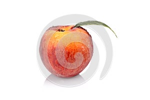 Studio shot of whole fresh peach isolated on a white background