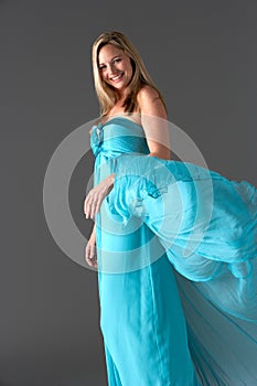 Studio Shot Of Woman In Blue Evening Dress