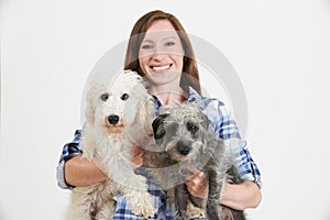 Studio Shot Of Woman With Two Pet Lurcher Dogs