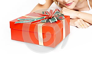 Studio shot of woman waiting for happness time to open christmas gift