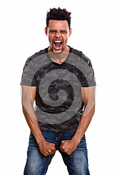 Studio shot of young African man looking furious