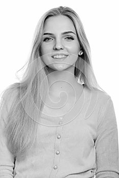 Studio shot of young happy teenage girl smiling