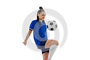 Studio shot of young female soccer, football player workout isolated on white studio background. Sport, action, motion