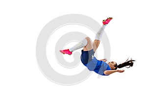 Studio shot of young female soccer, football player workout isolated on white studio background. Sport, action, motion