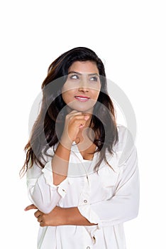 Studio shot of young happy Persian woman smiling while thinking