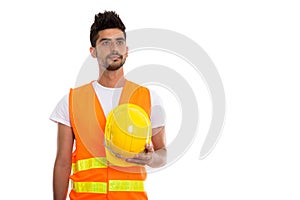 Studio shot of young Persian man construction worker holding saf