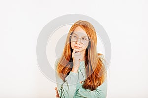 Studio shot of young preteen red-haired girl