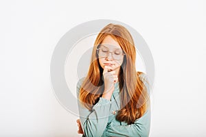 Studio shot of young preteen red-haired girl