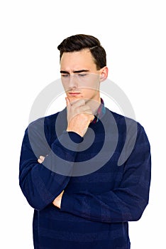 Studio shot of young serious Caucasian man thinking isolated against white background