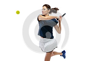 Studio shot of young sportive woman, tennis player training alone isolated on white background. Action, summer sports