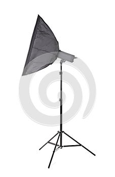 A studio softbox isolated on a white background. A professional studio equipment. A dark flashlight on a tall tripod. Outbreak.