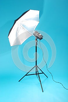 Studio strobe isolated on the blue background