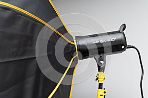 Studio strobe light flash with an umbrella